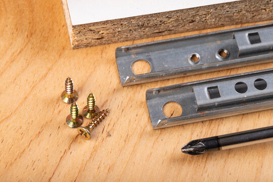 Metal sliding rails for mounting drawers in furniture.