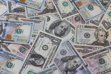 different US dollar banknotes background