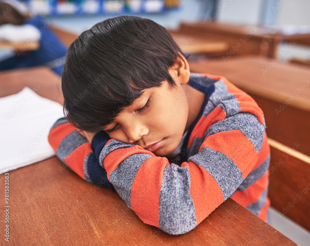 Poster desk, fatigue and sleeping with boy student in classroom at school for child development or learning
