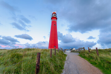 The red lighthouse north tower (Noordertoren) on the dune, Schiermonnikoog is a municipality and...