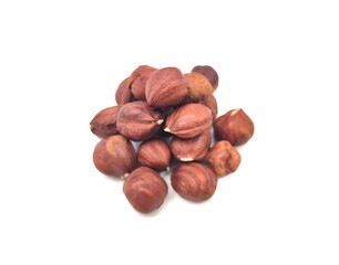 Top view of a heap of raw hazelnuts, rich in healthy fats, vitamins E and B, and essential minerals like magnesium. These nutritious nuts provide heart health benefits and are a great snack.