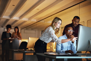Business woman, men and night with computer, management and review in web design or teamwork. Colleagues, technology and working late on project deadline for digital agency, coworking space or office