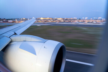 Wingview of a Modern Jet Aircraft Arriving at Hamburg Airport in the Evening
