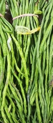 green long beans at traditional market