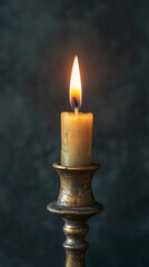 Candle burning in rustic holder, warm glow