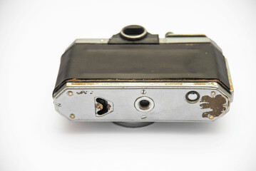 Poorly treated photo camera destroyed by time damaged broken