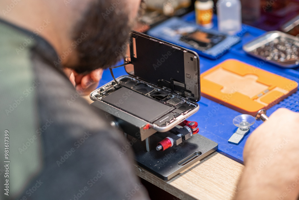 Poster a technician carefully repairs a phone, focusing on battery replacement and intricate components in 