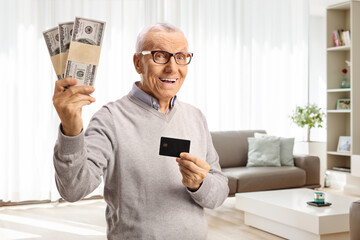 Elderly man holding money and credit card