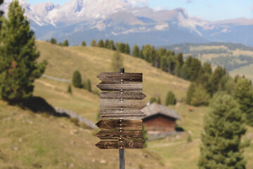road sign in the mountains on cloudy sky
