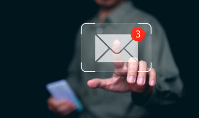 New email notification and online communication technology concept. Hand of businessman taps on mail with notifying alert for business e-mail and digital marketing. Inbox receiving electronic message