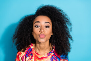 Photo portrait of beautiful woman with curly hair chevelure in trendy sweatshirt pouted lips kissing cadre isolated on blue color background