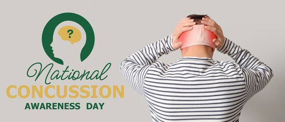 Young man with brain concussion and bandaged head on light background, back view