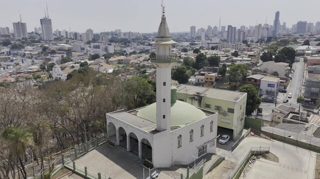 Drone does 360 around mosque on top of hill overlooking city in Cuiab&aacute;, Mato Grosso, Brazil