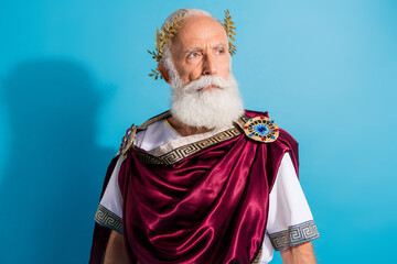 Photo of powerful mature man look confident empty space wear ancient roman emperor tunic isolated...