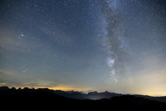 Clear starry sky with visible Milky Way and mountains in the background, Hochalp, Urn&auml;sch, Appenzell Ausserrhoden, Switzerland, Europe