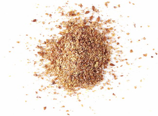 Ground, milled flaxseed pile, linseed flakes isolated on white background
