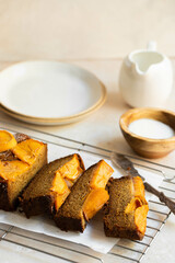 sliced persimmon bread with plates 