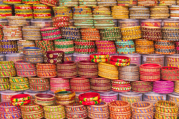 Colorful bangles for sale at an outdoor market.