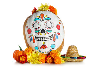 Pumpkin with painted skull, mini sombrero and flowers on white background. El Dia de Muertos