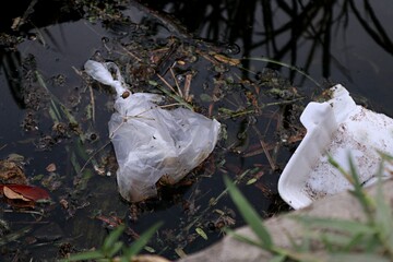 Plastic and styrofoam waste in the river