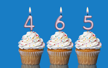 Birthday Cupcakes With Candles Lit Forming The Number 465