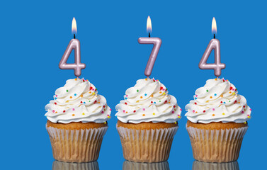 Birthday Cupcakes With Candles Lit Forming The Number 474