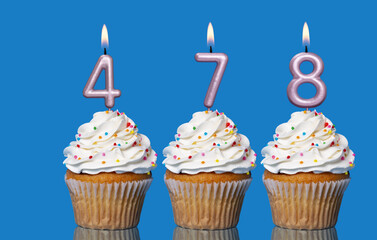 Birthday Cupcakes With Candles Lit Forming The Number 478