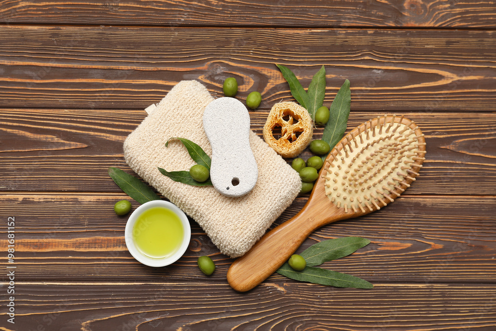 Wall mural composition with green olives, oil and bath supplies on wooden background