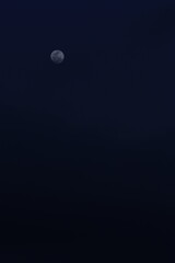 full moon over blue sky