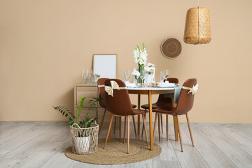 Interior of room with served dining table and white Gladiolus flowers