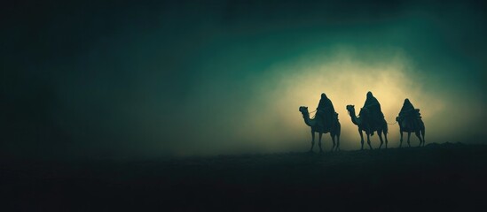 Three wise men on camels in the mist. 