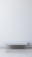A minimalist floating shelf set against a clean, white wall in a modern interior creates a sense of simplicity and calm, with ample empty space for a sleek, uncluttered look.