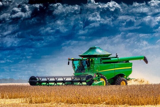 Lucas do Rio Verde, Mato Grosso - Brazil, January 18, 2024: Green John Deere combine harvester harvesting soybean crop. Agribusiness, agriculture - Lucas do Rio Verde, Mato Grosso, MT, Brazil.