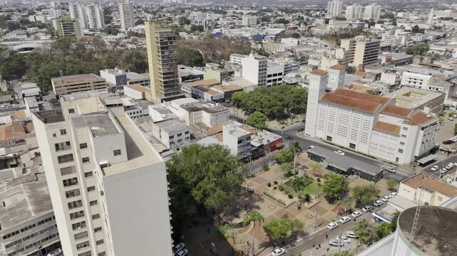 Drone orbits Praca Alencastro to in front of Catedral Bas&iacute;lica do Senhor Bom Jesus at Praca da Republica in Cuiab&aacute;, Mato Grosso, Brazil