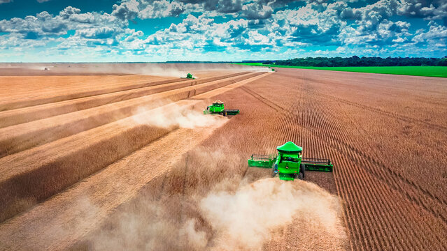 Lucas do Rio Verde, Mato Grosso - Brazil, January 18, 2024: Green John Deere combine harvester harvesting soybean crop. Agribusiness, agriculture - Lucas do Rio Verde, Mato Grosso, MT, Brazil.