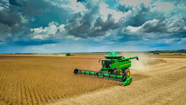 Lucas do Rio Verde, Mato Grosso - Brazil, January 18, 2024: Green John Deere combine harvester harvesting soybean crop. Agribusiness, agriculture - Lucas do Rio Verde, Mato Grosso, MT, Brazil.