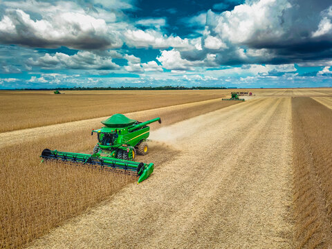 Lucas do Rio Verde, Mato Grosso - Brazil, January 18, 2024: Green John Deere combine harvester harvesting soybean crop. Agribusiness, agriculture - Lucas do Rio Verde, Mato Grosso, MT, Brazil.