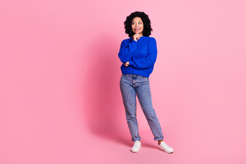 Full length photo of adorable lovely woman wear blue stylish clothes empty space isolated on pink color background