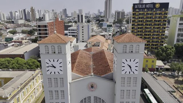 Drone flies backwards through the towers of Catedral Basilica do Senhor Bom Jesus in Cuiab&aacute;, Mato Grosso, Brazil