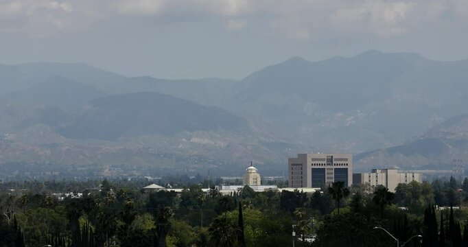 Sweltering heat rises from the valley in front of the downtown skyline of Van Nuys, Los Angeles, California, USA.