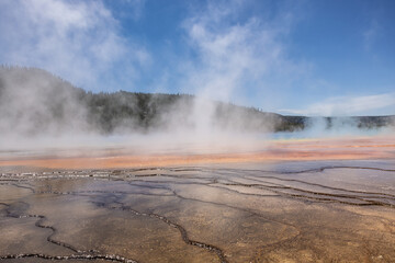 Close up photograph, water surface and cracks of the grand prismatic hot springs in Yellowstone National Park.