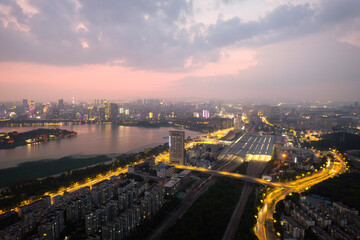 Serene Cityscape at Dusk: A Beautiful Urban Sunset Over Riverside