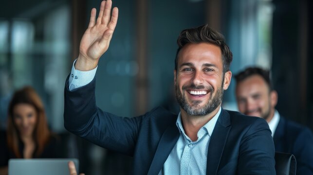Businessman raising his hand in a gesture of agreement during a meeting, showing enthusiasm and engagement