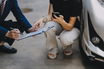 A young businesswoman is navigating car insurance options at her desk, considering premiums, deductibles, and coverage while understanding policies and managing claims efficiently.