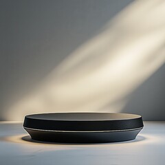 Dark modern podium or platform with soft lighting and dramatic shadows