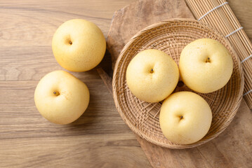 Asian pear fruit on wooden background, Sweet and juicy fruit, Table top view