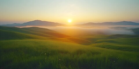 Fototapeta premium Aerial View of Misty Green Field with Sunrise in the Background