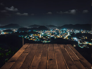 Fototapeta premium View from wooden plank above phuket town at night