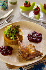 A closeup for a duck confit dish
