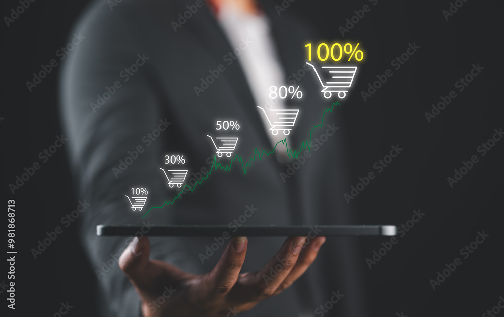 Aufkleber businessman holding tablet which display virtual graph chart and shopping trolley cart for increasin